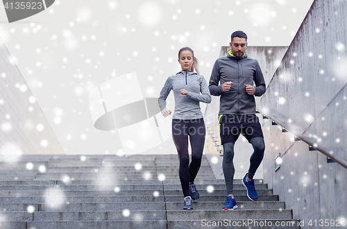 Image of couple of sportsmen walking downstairs