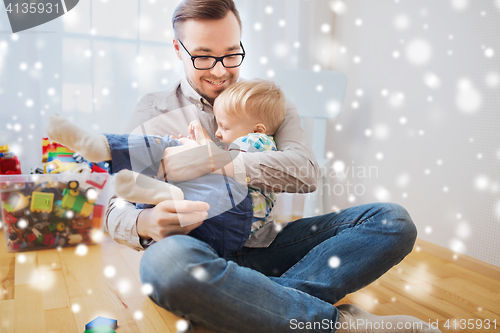 Image of father with son playing and having fun at home