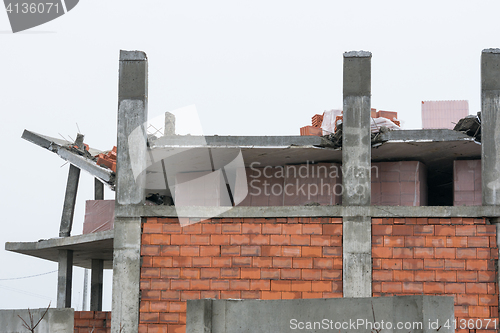 Image of The collapse of the roof of the house under construction