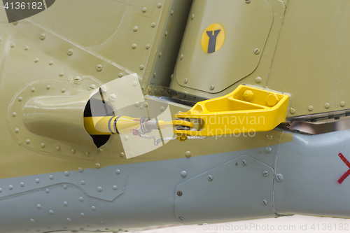 Image of Close-up of airplane\'s tail fin flying plane in background