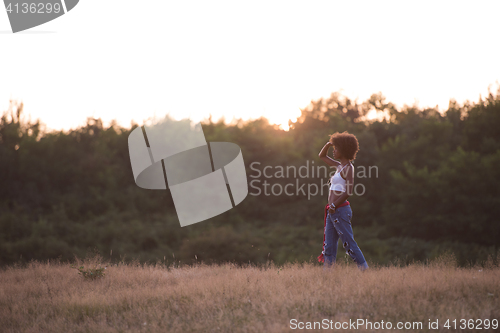 Image of young black woman in nature