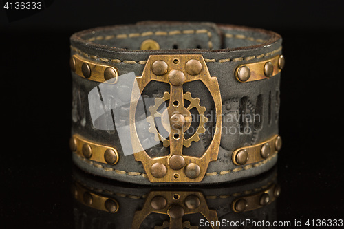 Image of Brown leather bracelet isolated on a black