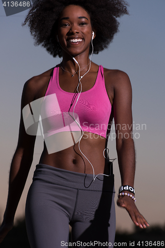 Image of black woman is doing stretching exercise relaxing and warm up