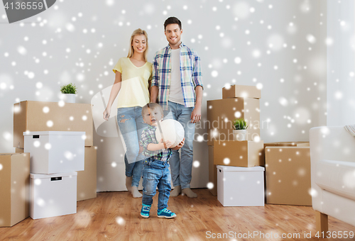 Image of happy family moving to new home and playing ball