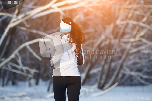 Image of Sport girl in winter forest