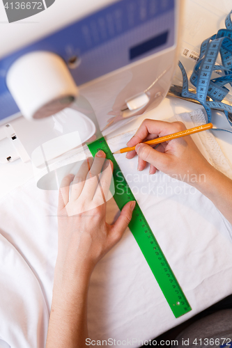 Image of Seamstress makes pattern top view