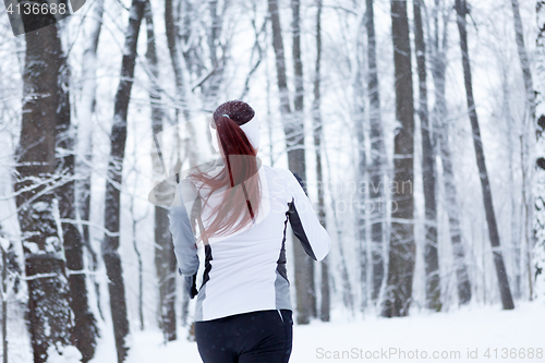 Image of Young brunette in winter park