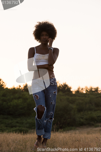 Image of young black woman in nature