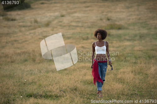 Image of young black woman in nature