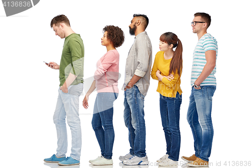 Image of group of people in queue with smartphone