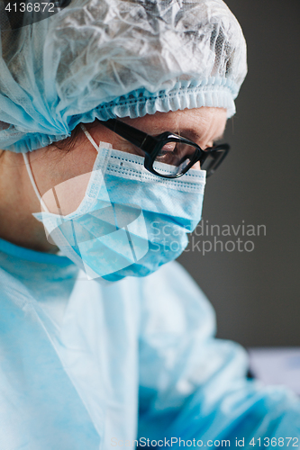 Image of Crop hands putting microscope glasses in box