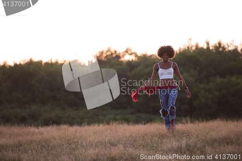 Image of young black woman in nature