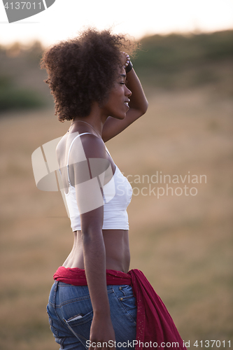 Image of young black woman in nature