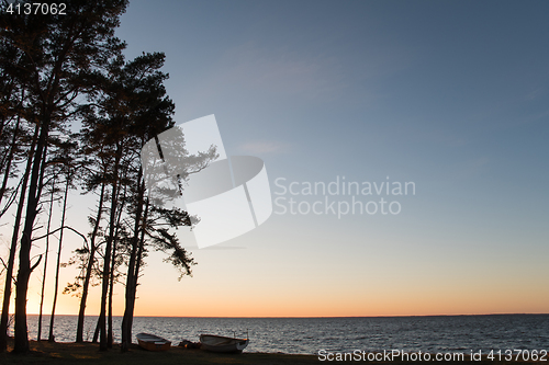 Image of Evening with rowboats by the sea