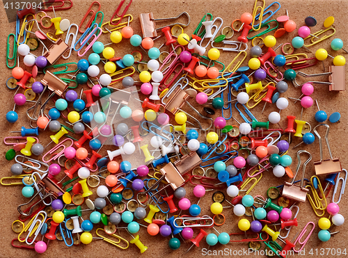 Image of Background of drawing pins, paper clips and binder clips