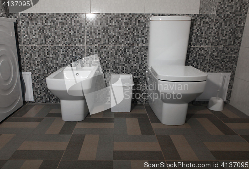 Image of white modern toilet and bidet 