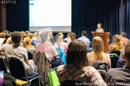 Image of Audience in lecture hall participating at business event.