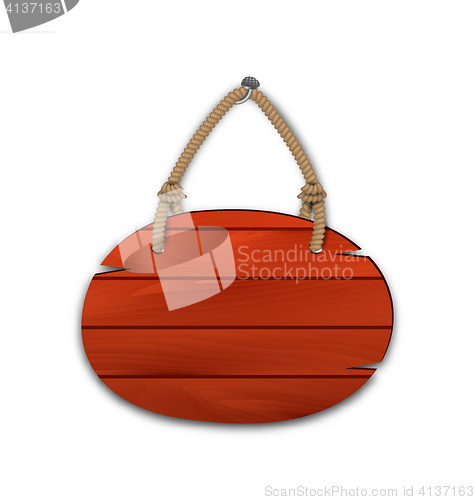 Image of Round wooden billboard with rope hanging on a nail