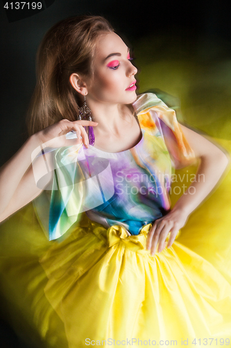 Image of beautiful woman in long yellow dress