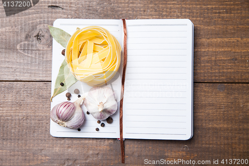 Image of blank paper with pasta, pepper and spices