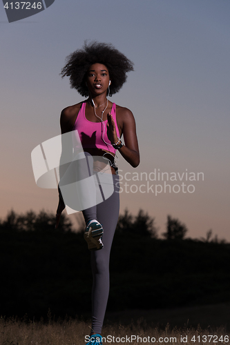 Image of black woman is doing stretching exercise relaxing and warm up