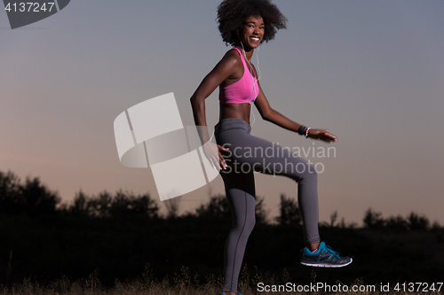 Image of black woman is doing stretching exercise relaxing and warm up