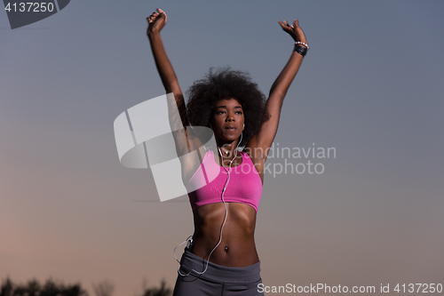 Image of black woman is doing stretching exercise relaxing and warm up