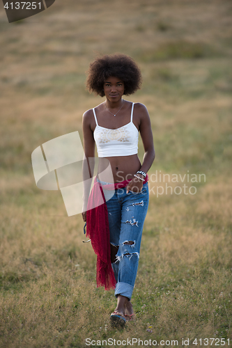 Image of young black woman in nature