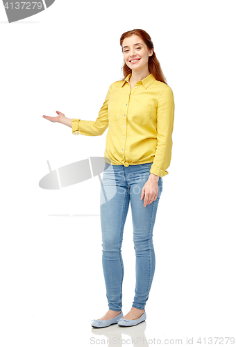 Image of happy woman holding something imaginary on hand