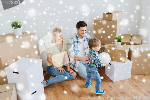 Image of happy family moving to new home and playing ball