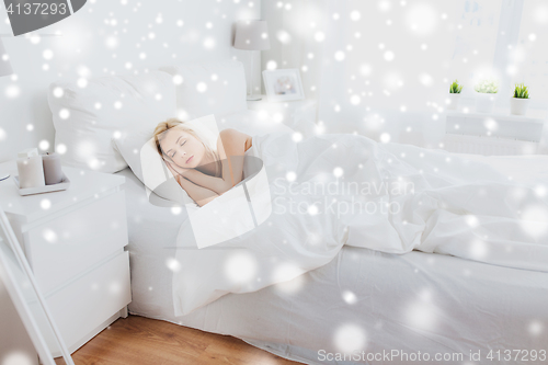 Image of young woman sleeping in bed at home bedroom