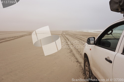 Image of car on sand