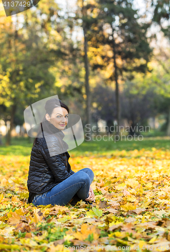 Image of Woman in a Forest in the Autumn