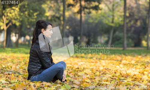 Image of Woman in a Forest in the Autumn