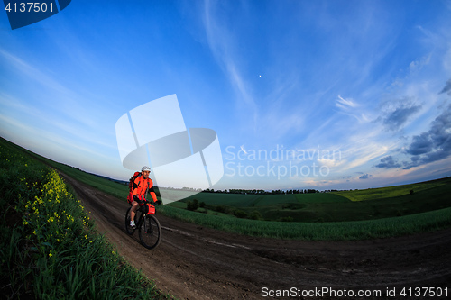 Image of Young man is riding bicycle outside. Healthy Lifestyle.