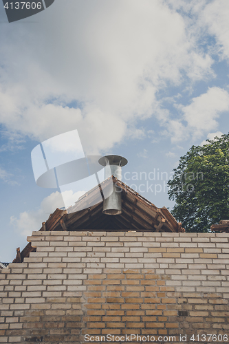 Image of Steel chimney at a damaged building