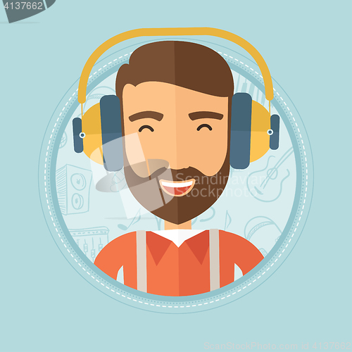 Image of Man listening to music in headphones.