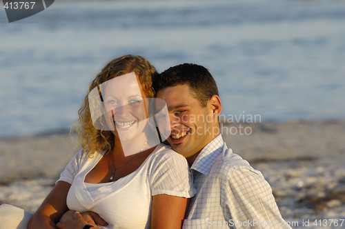 Image of Young happy couple at beach