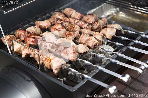 Image of Grilling shashlik on a barbeque grill outdoor