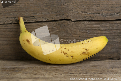 Image of Yellow banana on wooden background  