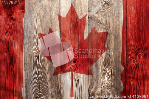 Image of National flag of Canada, wooden background