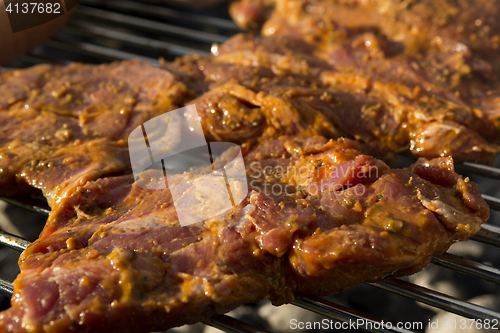 Image of Closeup of pork on a BBQ grill