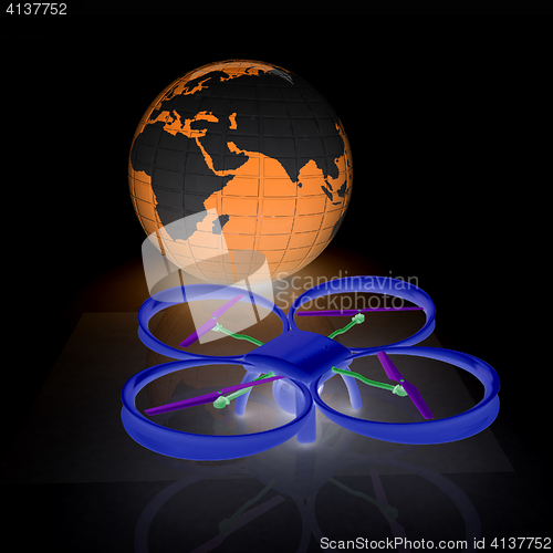 Image of Quadrocopter Drone with Earth Globe and remote controller on a w