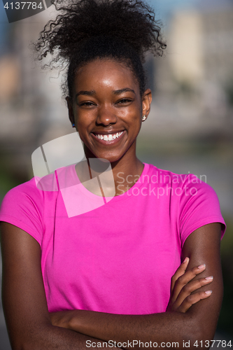 Image of Portrait of sporty young african american woman running outdoors