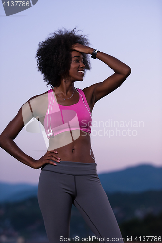 Image of portrait of african american woman jogging in nature