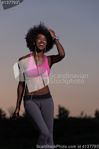 Image of black woman is doing stretching exercise relaxing and warm up