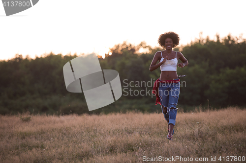 Image of young black woman in nature