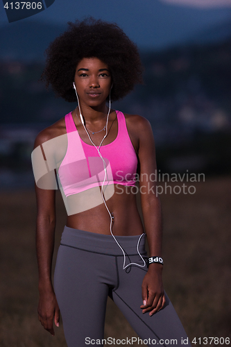 Image of portrait of african american woman jogging in nature