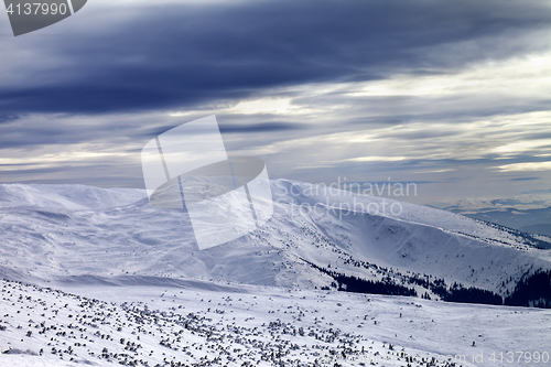 Image of Winter mountains and gray sky before blizzard