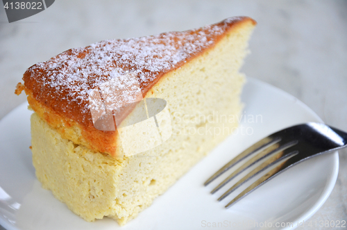 Image of Yellow cheese cake on table